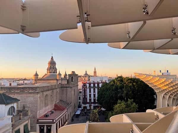 Witnessing how beautiful the sun illuminates Seville's blend of modern and historic structures.